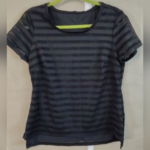 Woman's stretchy athletic top. See close up for the sheer design